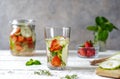 Infused water with strawberry and meloncella that is hybrid of cucumber and melon, thyme, mint. Royalty Free Stock Photo