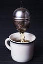 Infuser in cup Making tea Royalty Free Stock Photo