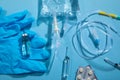 Infusion bag, syringe, medical ampoules in the blue background. IV drip chamber Royalty Free Stock Photo