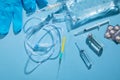 Infusion bag, syringe, medical ampoules in the blue background. IV drip chamber Royalty Free Stock Photo