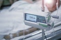 Infusion pumps with blurry patient in hospital. with blurry patient in hospital