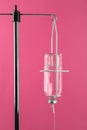 Infusion set on pink background. Intravenous therapy Royalty Free Stock Photo