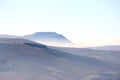 Ingleborough rising above mist in North Yorkshire Royalty Free Stock Photo