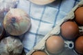 Ingredient in the kitchen with sunlight from the window. Close up view of ingredients of fried egg and vintage pot.