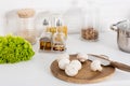 ingredientes and mushrooms on wooden board with knife