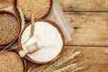 Ingredients for baking bread: wheat ears and a bowls of flour and grains Royalty Free Stock Photo