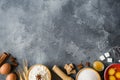 Ingredients for baking a cake at home. Flour and sugar, eggs with butter, spices on a dark brutal table Selective focus Royalty Free Stock Photo
