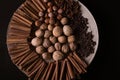 ingredients for baking, cinnamon sticks, star anise, cloves, nuts, coconut, coffee beans on a wooden background Royalty Free Stock Photo