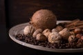 ingredients for baking, cinnamon sticks, star anise, cloves, nuts, coconut, coffee beans on a wooden background Royalty Free Stock Photo