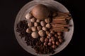 Ingredients for baking, cinnamon sticks, star anise, cloves, nuts, coconut, coffee beans on a wooden background Royalty Free Stock Photo