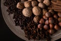 Ingredients for baking, cinnamon sticks, star anise, cloves, nuts, coconut, coffee beans on a wooden background Royalty Free Stock Photo