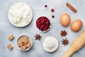 Ingredients for baking cookies, cupcakes and cake. Raw foods eggs flour sugar cottage cheese cranberries on a grey background with