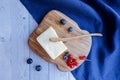 Ingredients for baking lie on a light wooden background with a blue kitchen towel. butter, berries and wooden Royalty Free Stock Photo