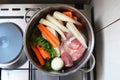 Ingredients for beef soup in pot. Meat, fresh vegetables and herbs prepared for cooking beef soup. Top view Royalty Free Stock Photo