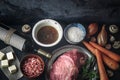 Ingredients for Boeuf Bourguignon on the dark stone table top view Royalty Free Stock Photo