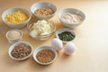 Ingredients in bowls for a healthy low carb bread with protein, whole grain flour and seeds, homemade baking recipe for obesity