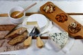 Ingredients for the bruschetta: cheese camembert, DorBlu, salty blue cheese with mold, nuts and honey on light background