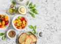 Ingredients for bruschetta - tomatoes, avocado, basil, olive oil, bread. Royalty Free Stock Photo