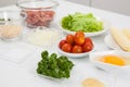 Ingredients for burger. Step by step preparation of mini burgers. Homemade mini burgers for children or appetizers. Small