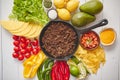 Ingredients for Chili con carne in frying iron pan on white wooden table Royalty Free Stock Photo