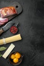 Ingredients for cooking Carbonara pasta, spaghetti with pancetta, egg and hard parmesan cheese., on black stone background, top Royalty Free Stock Photo