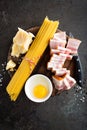 Ingredients for cooking Carbonara pasta, spaghetti with pancetta, egg and hard parmesan cheese. Traditional italian cuisine. Pasta Royalty Free Stock Photo