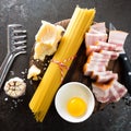 Ingredients for cooking Carbonara pasta, spaghetti with pancetta, egg and hard parmesan cheese. Traditional italian cuisine. Pasta Royalty Free Stock Photo