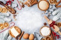 Ingredients for cooking christmas baking decorated with fir tree. Flour, brown sugar, eggs and spices top view. Bakery background. Royalty Free Stock Photo
