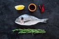 Ingredients for cooking dorado fish. Black background top view Royalty Free Stock Photo