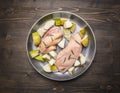 Ingredients for cooking duck breast with fruit, herbs and honey in a frying pan wooden rustic background top view close up