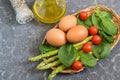 Ingredients for cooking frittata with asparagus, cherry tomatoes