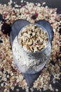 Ingredients for cooking healthy breakfast. Nuts, oat flakes, dried fruits, honey, granola, wooden heart . Royalty Free Stock Photo