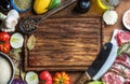 Ingredients for cooking healthy meat dinner. Raw uncooked lamb chops with vegetables, rice, herbs and spices over rustic Royalty Free Stock Photo