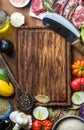 Ingredients for cooking healthy meat dinner. Raw uncooked lamb chops with vegetables, rice, herbs and spices over rustic Royalty Free Stock Photo