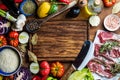 Ingredients for cooking healthy meat dinner. Raw uncooked lamb chops with vegetables, rice, herbs and spices over rustic wooden ba Royalty Free Stock Photo