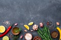 Ingredients for cooking. Herbs and spices on black stone table top view. Food background. Royalty Free Stock Photo