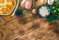 Ingredients for cooking Italian pasta on wooden table with border Royalty Free Stock Photo
