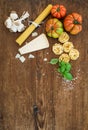 Ingredients for cooking pasta. Spaghetti, tagliatelle, garlic, Parmesan cheese, tomatoes and fresh basil on rustic Royalty Free Stock Photo