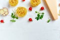 Ingredients for cooking pasta - tagliatelle, tomato, garlic, basil, parmesan cheese Royalty Free Stock Photo