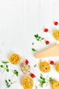 Ingredients for cooking pasta - tagliatelle, tomato, garlic, basil, parmesan cheese Royalty Free Stock Photo