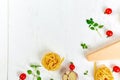 Ingredients for cooking pasta - tagliatelle, tomato, garlic, basil, parmesan cheese Royalty Free Stock Photo