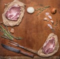 Ingredients for cooking pork steaks with knife for meat and meat fork on rustic wooden background top view,frame