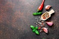 Ingredients for cooking. Red pepper, garlic, basil leaves, pepper corns on background. Top view. Food Background Royalty Free Stock Photo