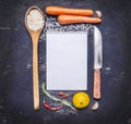 Ingredients for cooking rice with vegetables, a knife, a wooden spoon, lemon, spicy, pepper, garlic lined frame with sheet of pap Royalty Free Stock Photo