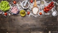 Ingredients for cooking risotto with ham, cheese, vegetables and spices and rice, wooden spoon, cherry tomatoes, oil salt bord