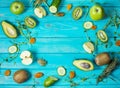 Ingredients for cooking smoothie. Organic green vegetables and fruits on wooden blue rustic background. Copy space, flat Royalty Free Stock Photo