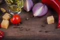 Ingredients for cooking spaghetti - raw pasta, tomato, olive oil, spices, herbs Royalty Free Stock Photo