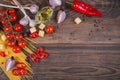 Ingredients for cooking spaghetti - raw pasta, tomato, olive oil, spices, herbs Royalty Free Stock Photo