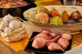 Ingredients for cooking on the table, shallots, purple onions and plums of different colors Royalty Free Stock Photo