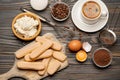 Ingredients for cooking tiramisu - Savoiardi biscuit cookies, mascarpone, cream, sugar, cocoa, coffee and egg Royalty Free Stock Photo